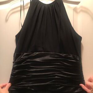 Beautiful formal black dress with side zipper. Below the knee.